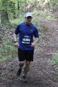 Doctor Ward running in a 15K cross country event.